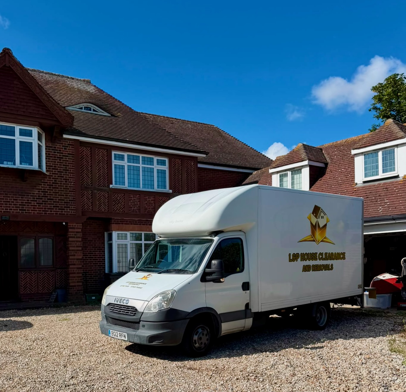 L&P removals van outside a house on moving day