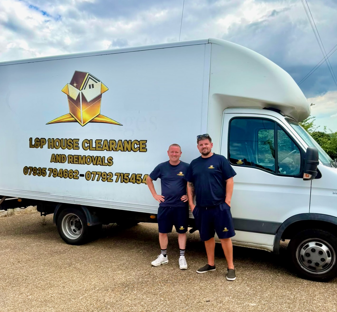 L&P team members standing by the removals van