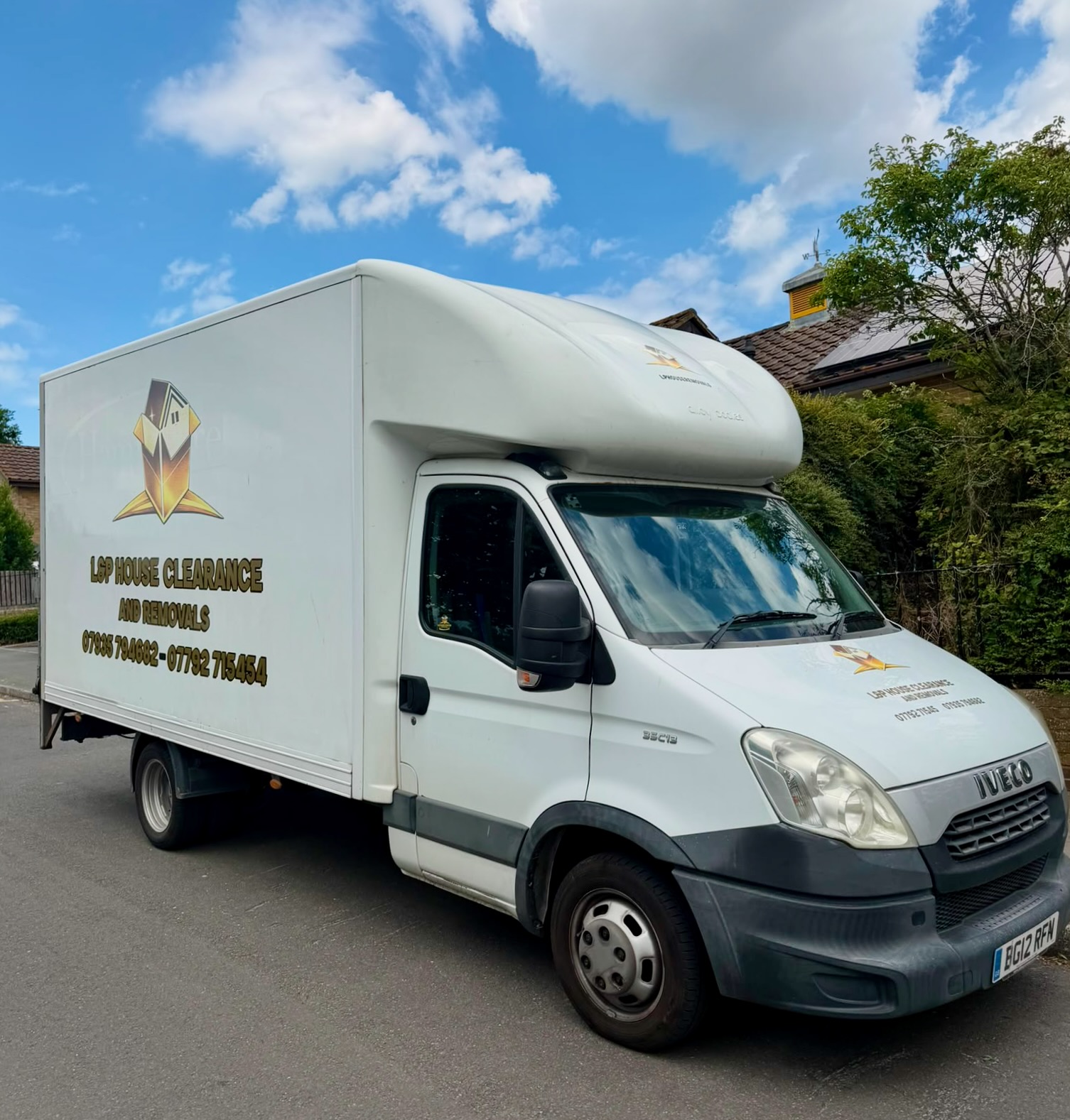 L&P removals van parked on a residential street